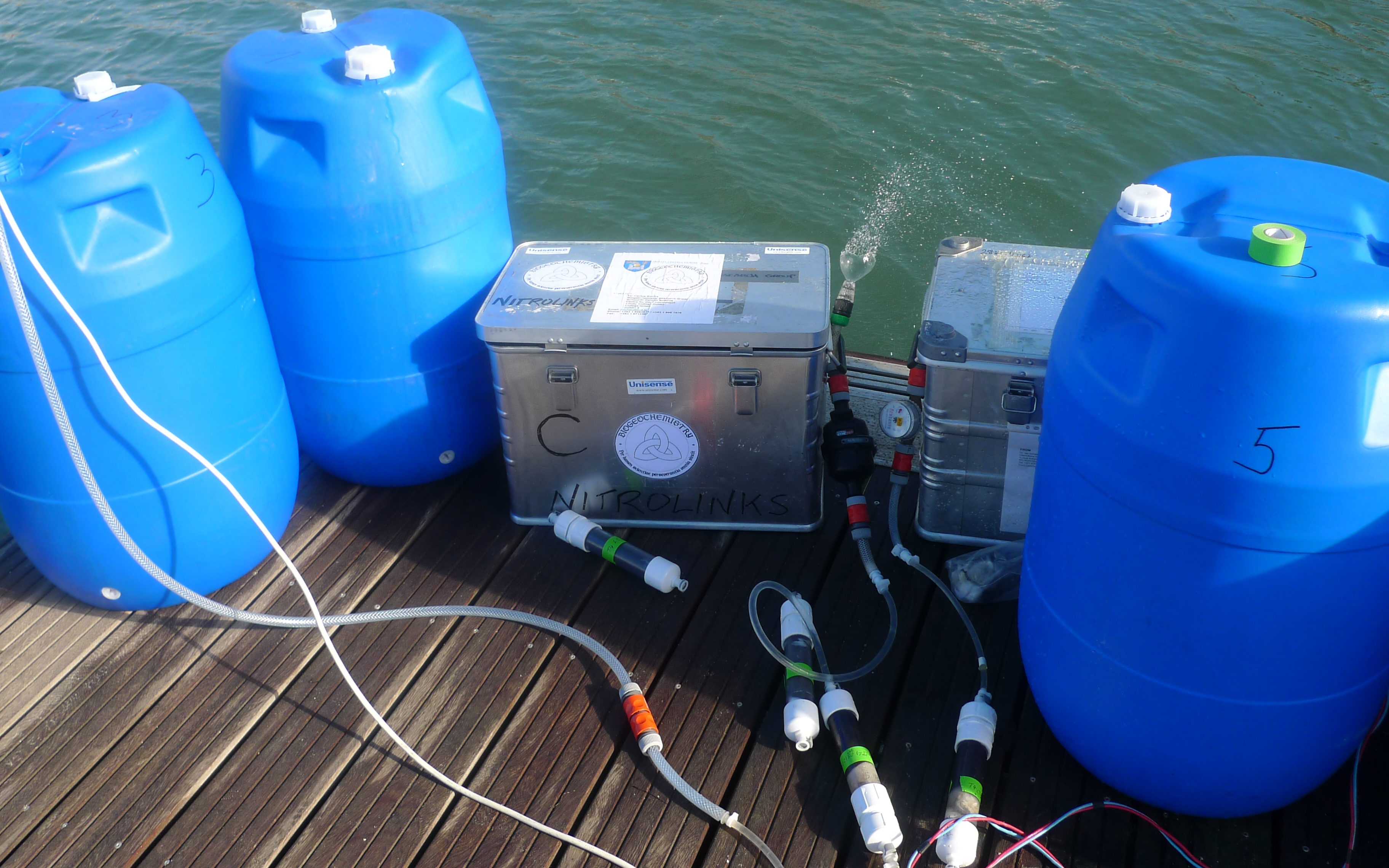 Water samples being filtered through manganese fiber filters, to capture natural isotopes of radium. 